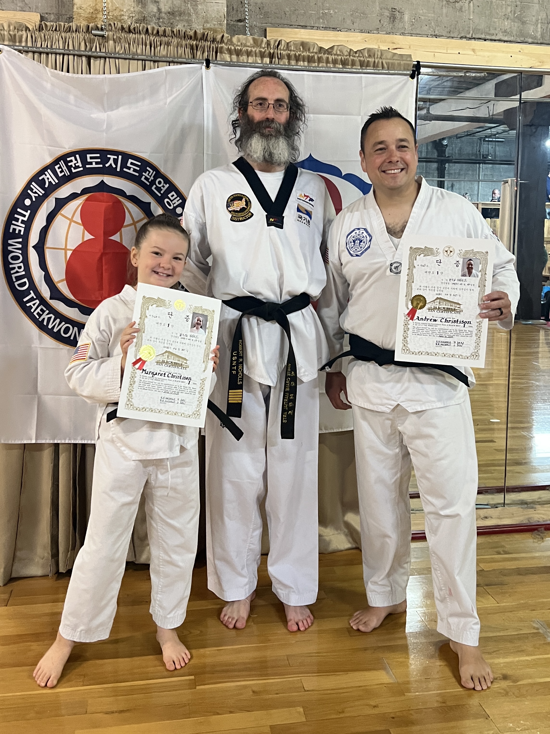 Andrew and his daughter Maisie at her first dan ceremony