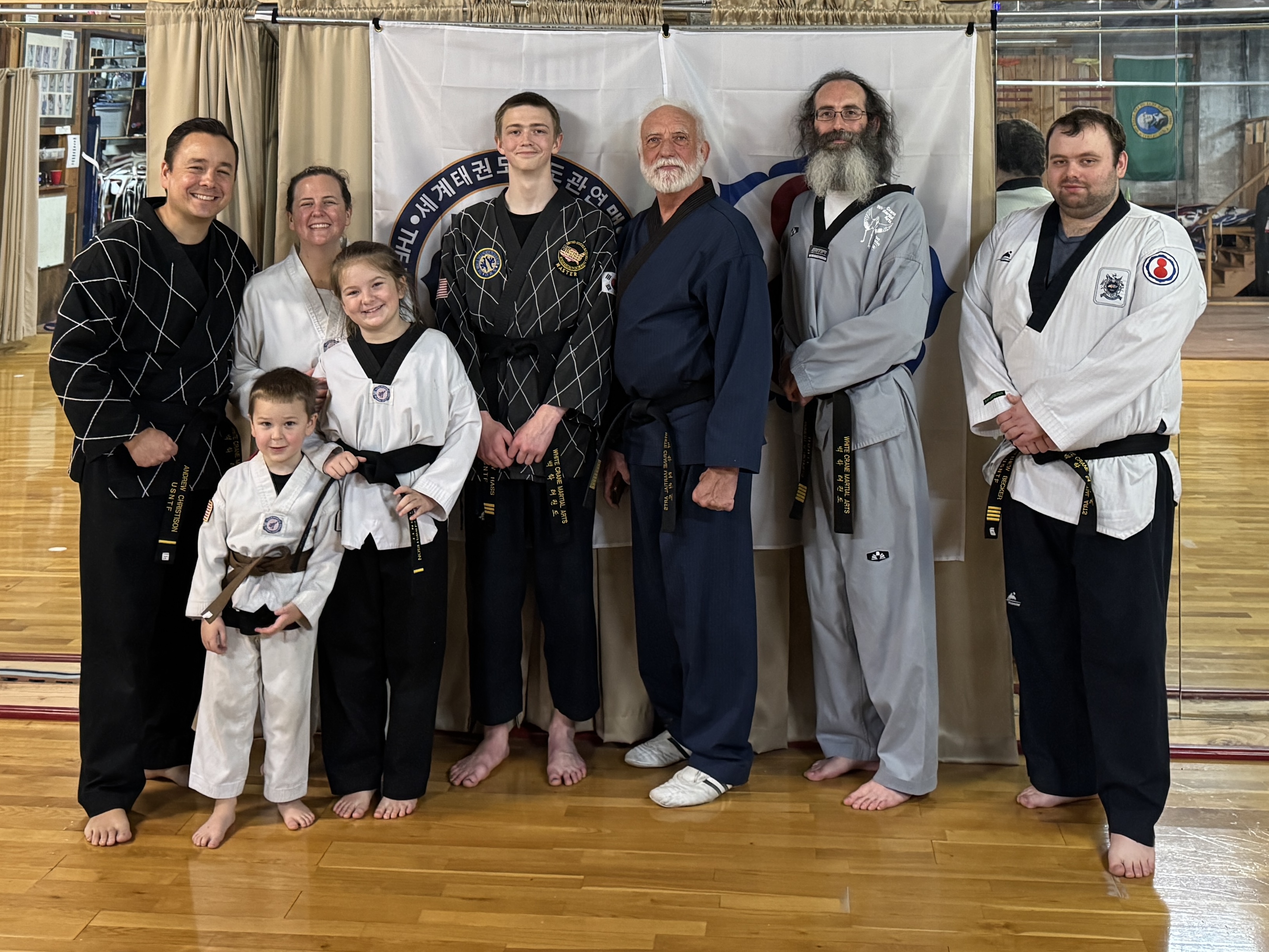 Andrew and family in taekwondo doboks